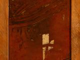 an old wooden frame with a cross painted on it