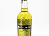 a bottle of chartreuse whisky sitting on top of a table