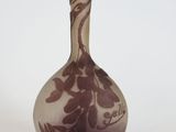 a vase that is sitting on a white surface