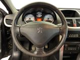dashboard of a car with a steering wheel and dashboard gauges