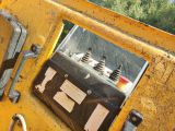 a close up of a mirror on the back of a tractor