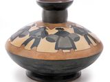 un vase noir et blanc orné d'une peinture