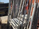 a lot of wooden sticks and a bucket of water