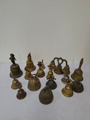 a lot of bells that are sitting on a table