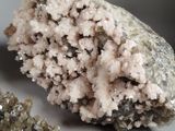 a piece of rock that has some kind of crystals on it