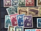 a lot of stamps that are on the table