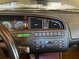 a car dashboard with a clock on it and a steering wheel