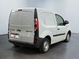 a white van that is parked in a room