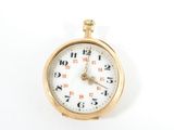 a gold pocket watch with a white face on a white surface
