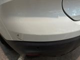 a close up of a car ' s rear bumper