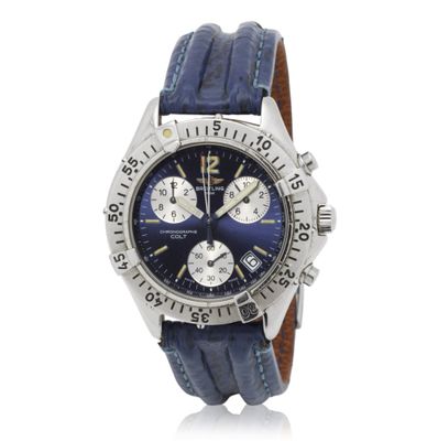 a close up of a wrist watch with a blue dial