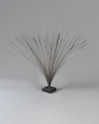an image of a sculpture of a plant on a white surface