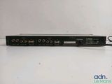 a close up of a black and white video player on a table