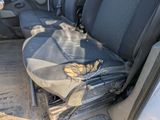 a dirty seat in the back of a truck