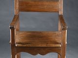 an old wooden chair sitting on top of a white floor