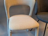 two chairs sitting next to each other in a room