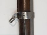 a close up of a wooden pole with a metal latch