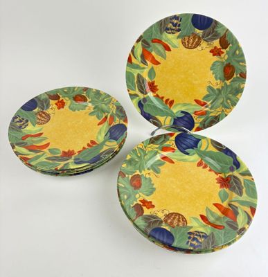 three plates with different designs on them sitting on a white surface