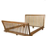 a wooden bed frame with a wooden slatt on it