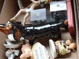 a box full of figurines that are in a box