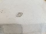 a silver plate with a blue and white design on it