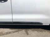 a white truck with a black door handle and a black door handle