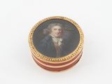 a picture of a miniature box with a painting of a man
