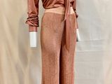 an image of a mannequin wearing a brown shirt and pants