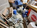 a room with a lot of clutter and tools on the floor