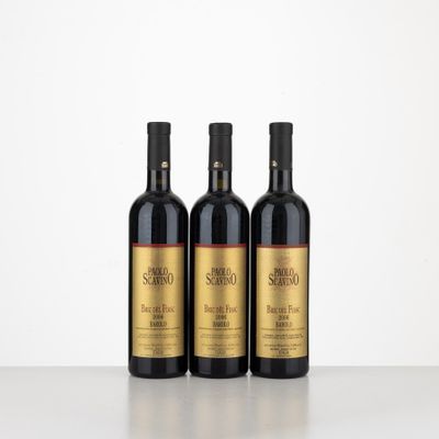 three bottles of wine sitting on top of a table next to each other