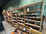many shelves with jars and jars on them in a store