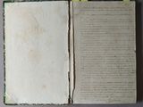 a book open with a piece of paper on top of it