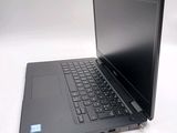 a laptop that is sitting on a white table