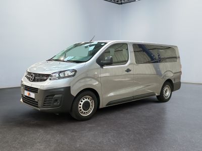 a silver van that is parked in a room