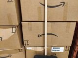 boxes stacked on top of each other with a black shovel on top of them