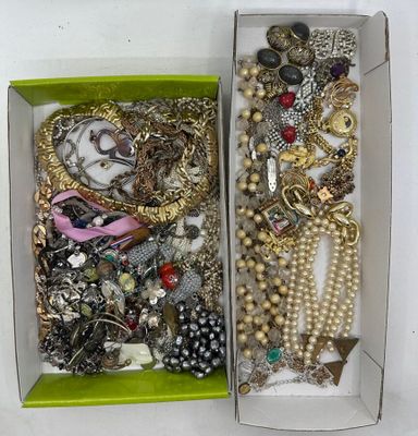 a box full of assorted jewelry sitting on a table