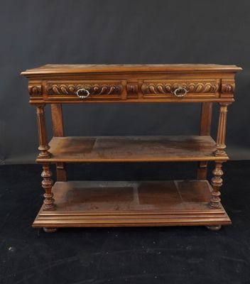 a wooden table with two shelves on top of it