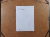 a picture of a piece of paper hanging on a wall