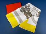 yellow, white, and red handkerchiefs on a blue surface
