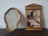 a small mirror and a small mirror on a table