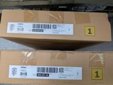 two boxes are stacked on top of each other on a conveyor belt