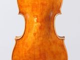 an old violin with a wooden back and bow on a white background