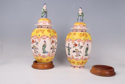 two vases sitting next to each other on a table