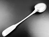 a spoon with a spoon handle on a black table
