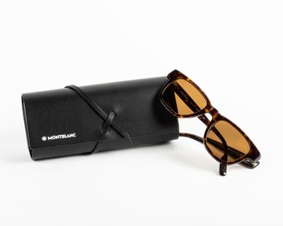 a pair of sunglasses sitting on top of a black case