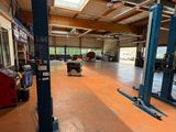 a large garage with a lot of equipment in it