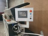 an image of a machine that is making a piece of paper