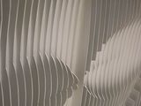 a close up of a wall made of white paper