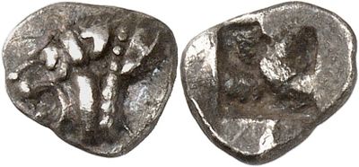 a close up of two silver coins with a man and woman on them