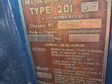 a plaque on the side of a blue car